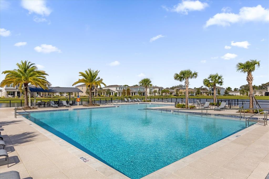 731 FIREROCK Lane DeBary, FL 32713 - Photo 35 of 39 a view of swimming pool with outdoor seating and lake view