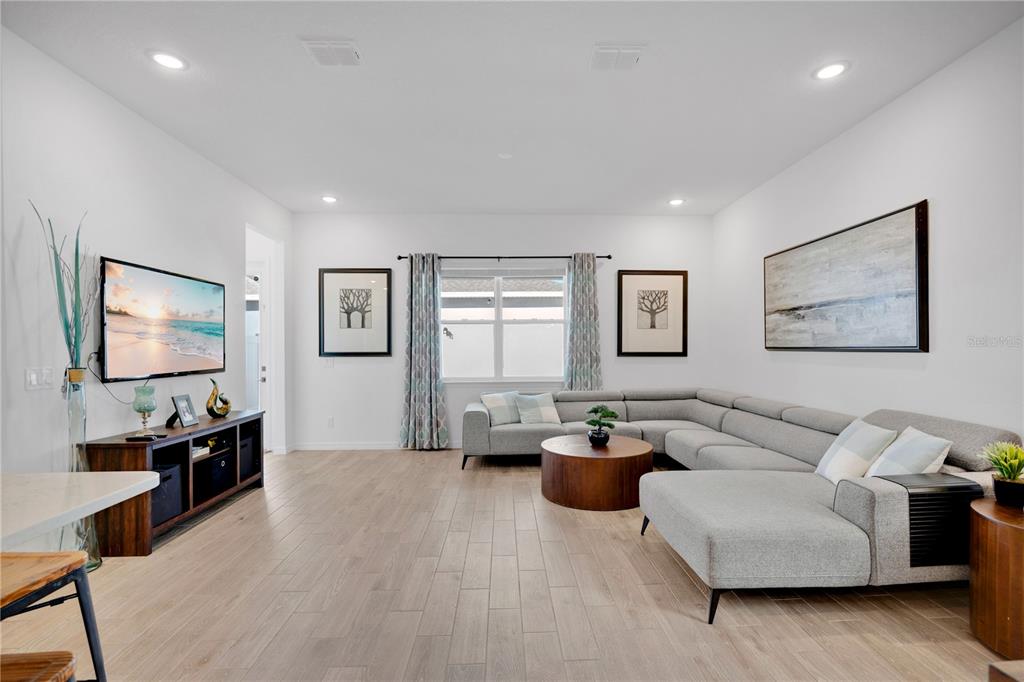 731 FIREROCK Lane DeBary, FL 32713 - Photo 8 of 39 a living room with furniture and a flat screen tv