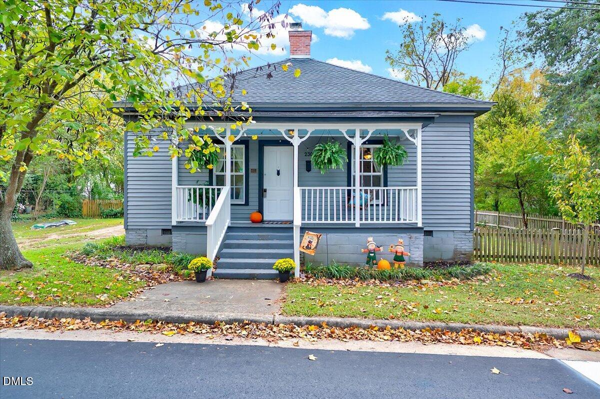 230 Brick Street Wake Forest, NC 27587 - Photo 1 of 38 a front view of a house with a garden