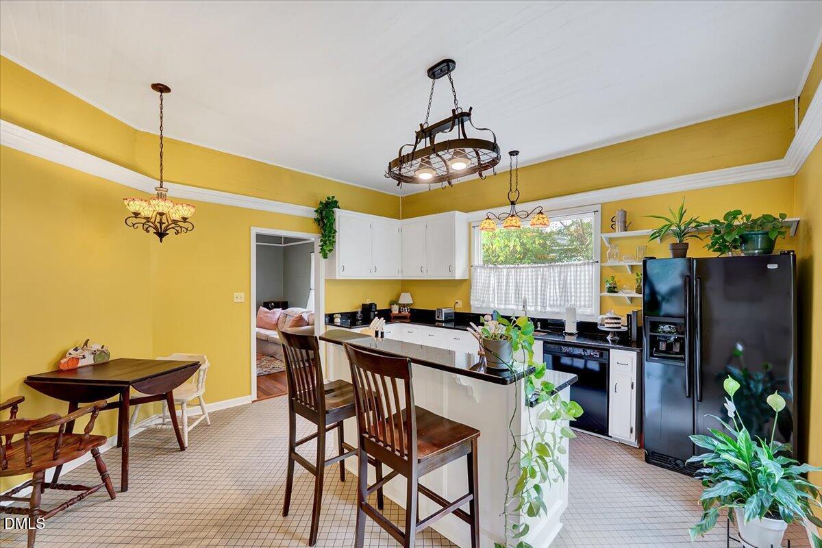230 Brick Street Wake Forest, NC 27587 - Photo 11 of 38 a view of a dining room with furniture window and wooden floor