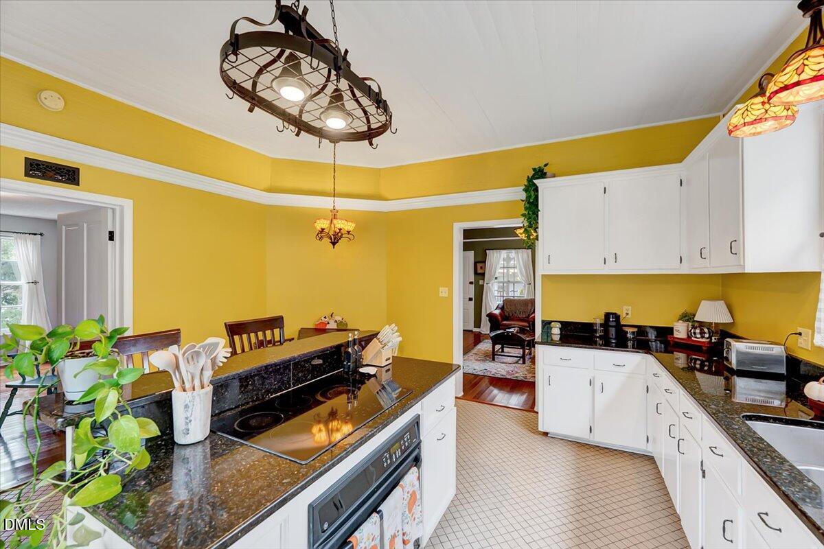 230 Brick Street Wake Forest, NC 27587 - Photo 13 of 38 a kitchen with stainless steel appliances granite countertop a stove a sink and a refrigerator