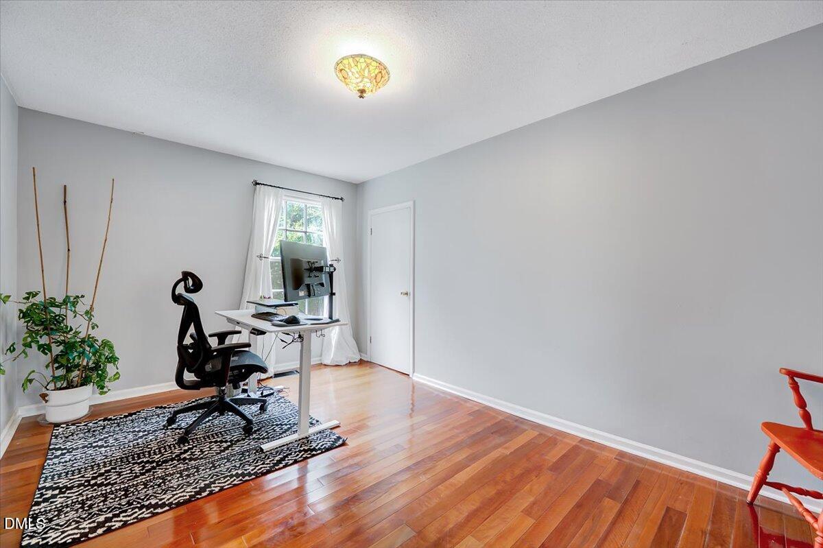230 Brick Street Wake Forest, NC 27587 - Photo 16 of 38 a living room with furniture and a wooden floor
