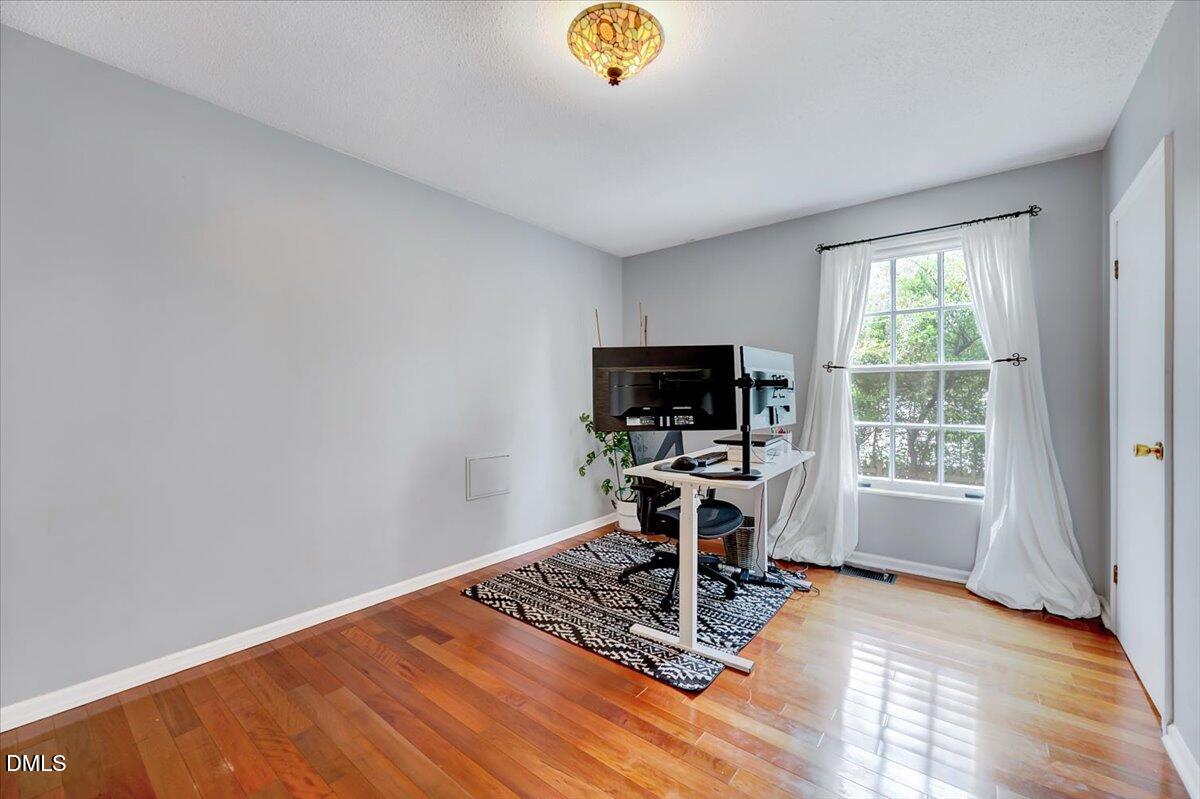 230 Brick Street Wake Forest, NC 27587 - Photo 17 of 38 a view of a workspace with furniture and a window