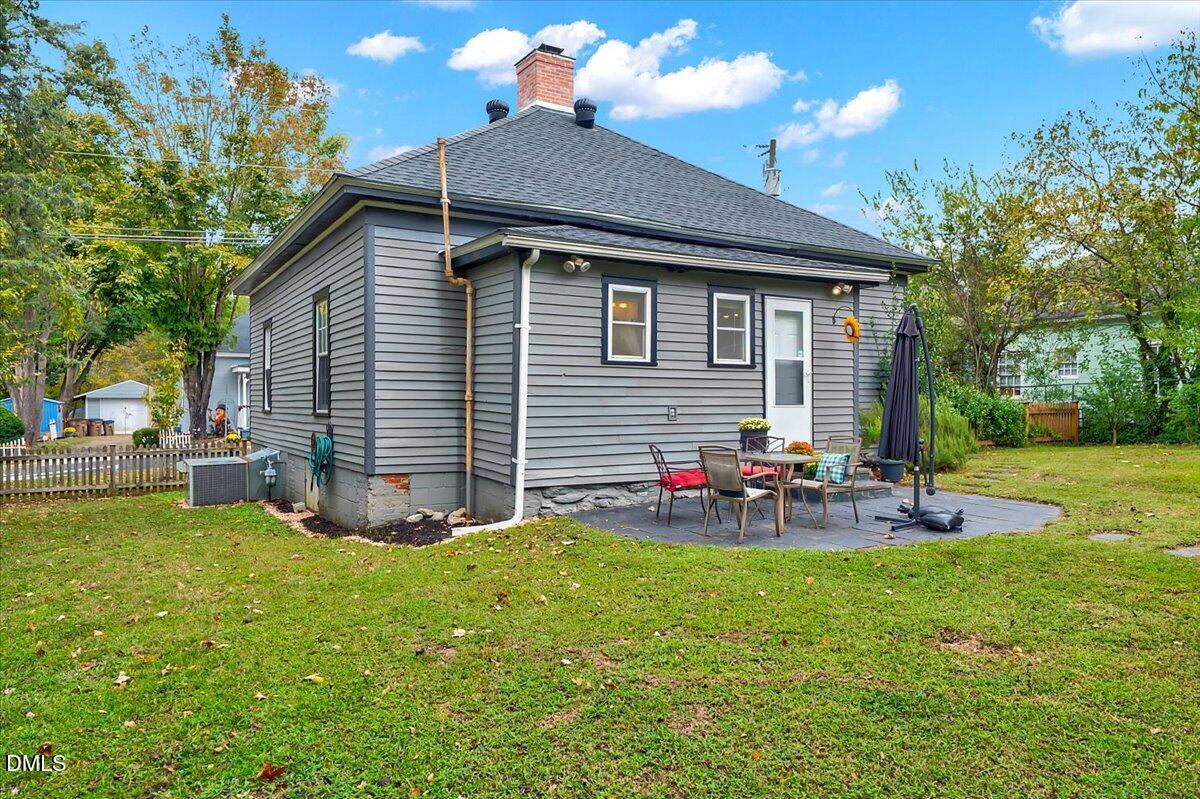 230 Brick Street Wake Forest, NC 27587 - Photo 20 of 38 a view of a house with a yard and sitting area