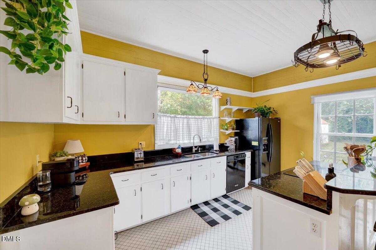 230 Brick Street Wake Forest, NC 27587 - Photo 3 of 38 a kitchen with a sink and a stove