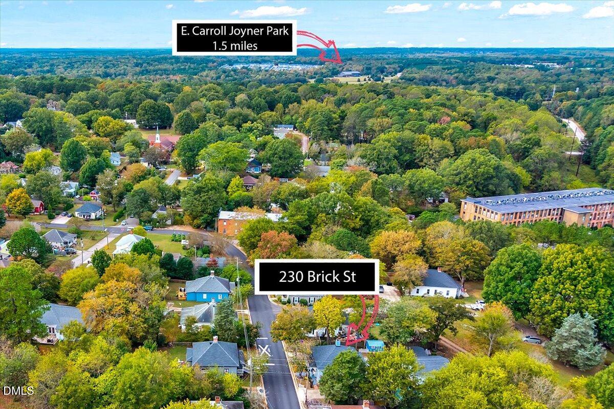 230 Brick Street Wake Forest, NC 27587 - Photo 37 of 38 a sign that is sitting in front of flowers