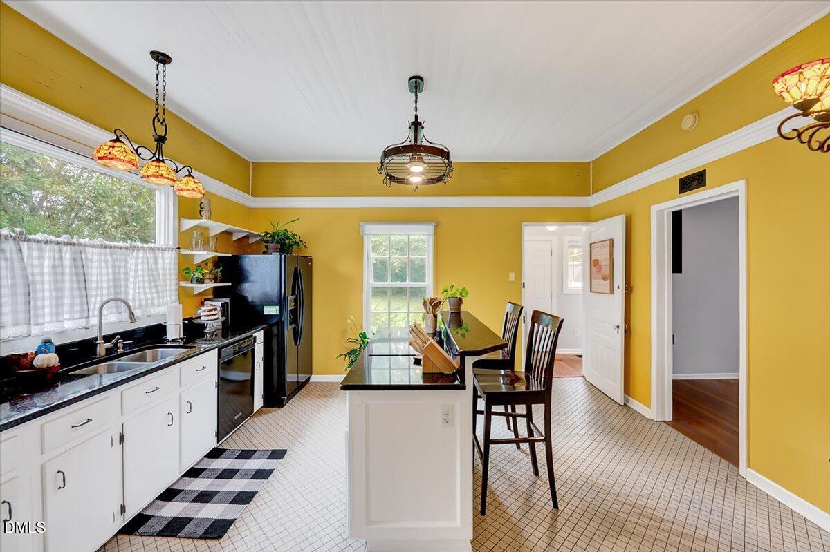 230 Brick Street Wake Forest, NC 27587 - Photo 10 of 38 a kitchen with sink and view of living room