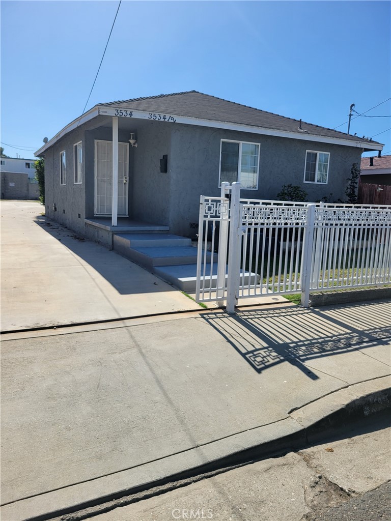 3534 139th Street Hawthorne, CA 90250 - Photo 1 of 7 a front view of a house with wooden fence