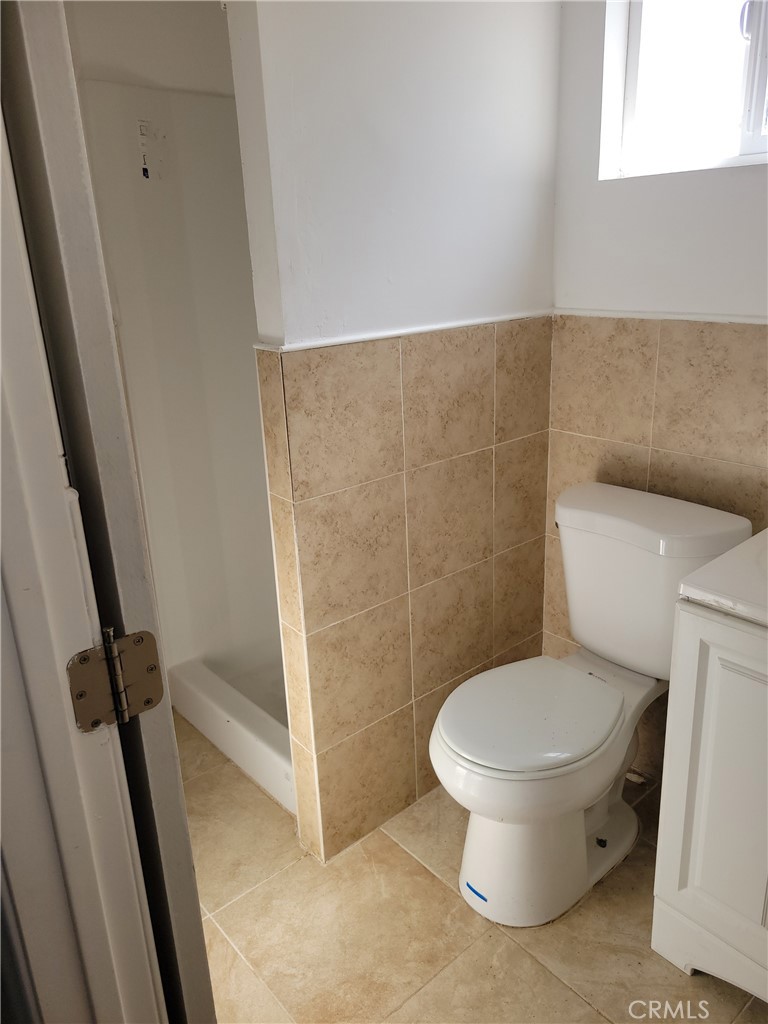 3534 139th Street Hawthorne, CA 90250 - Photo 4 of 7 a white toilet sitting next to a sink