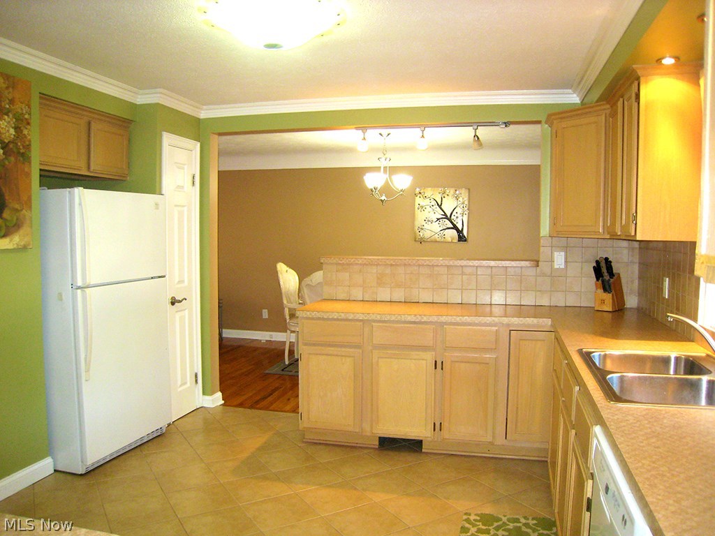 6925 Maplewood Road Parma Heights, OH 44130 - Photo 3 of 25 Breakfast bar with island leading into separate dinning area.