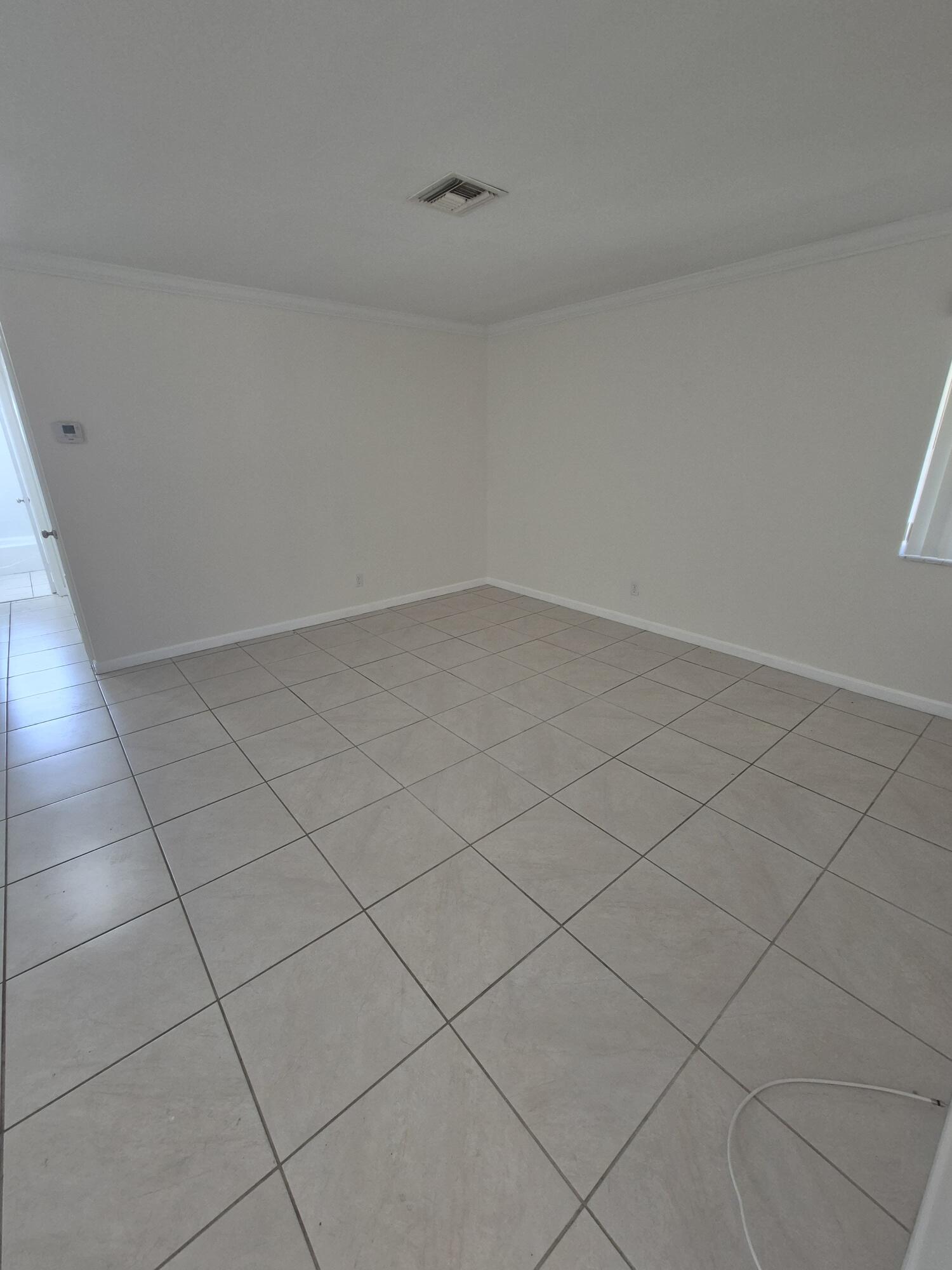 3518 Taylor Street, Unit 4 Hollywood, FL 33021 - Photo 11 of 13 a view of an empty room
