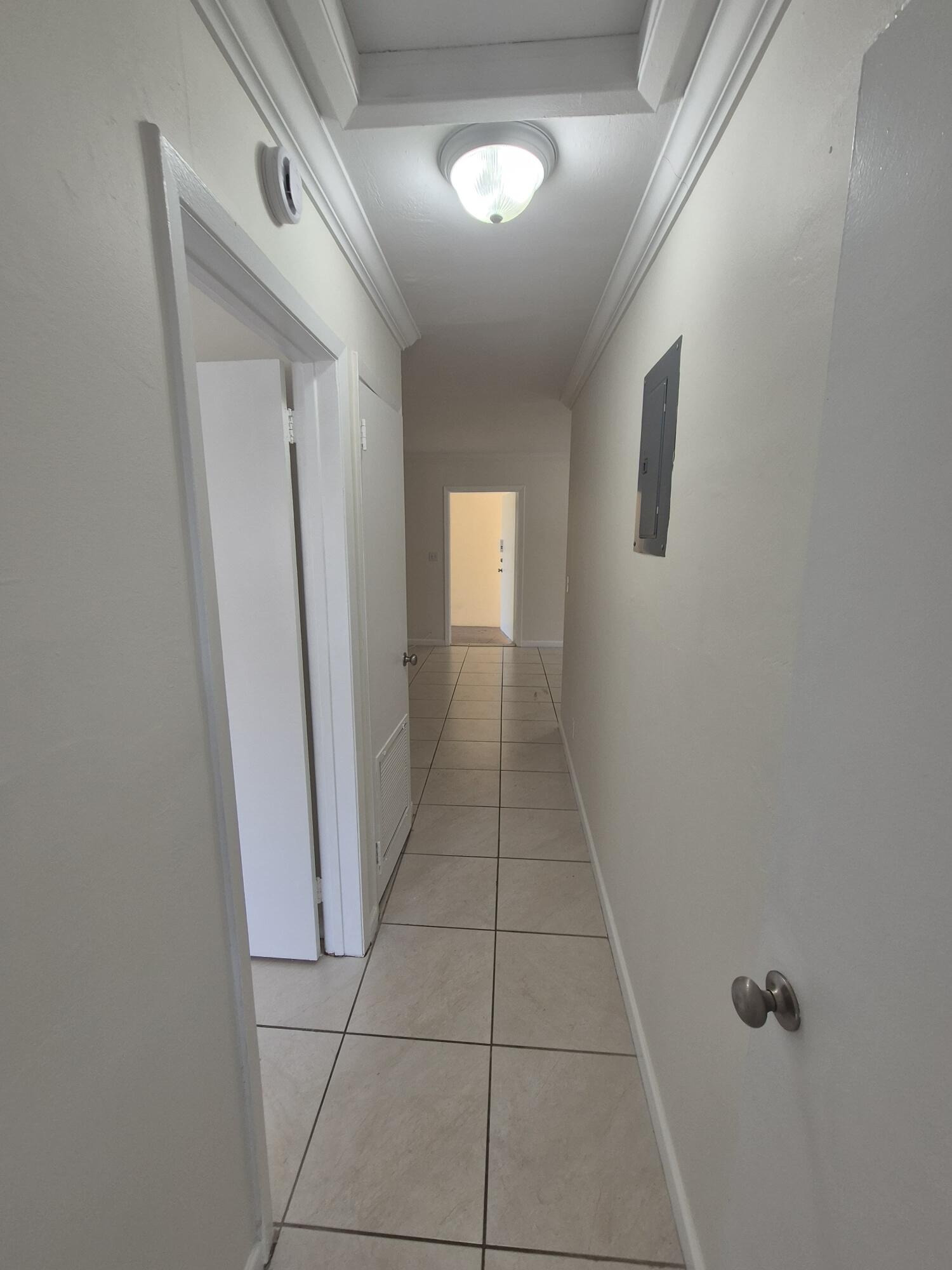 3518 Taylor Street, Unit 4 Hollywood, FL 33021 - Photo 13 of 13 a view of a hallway to rooms