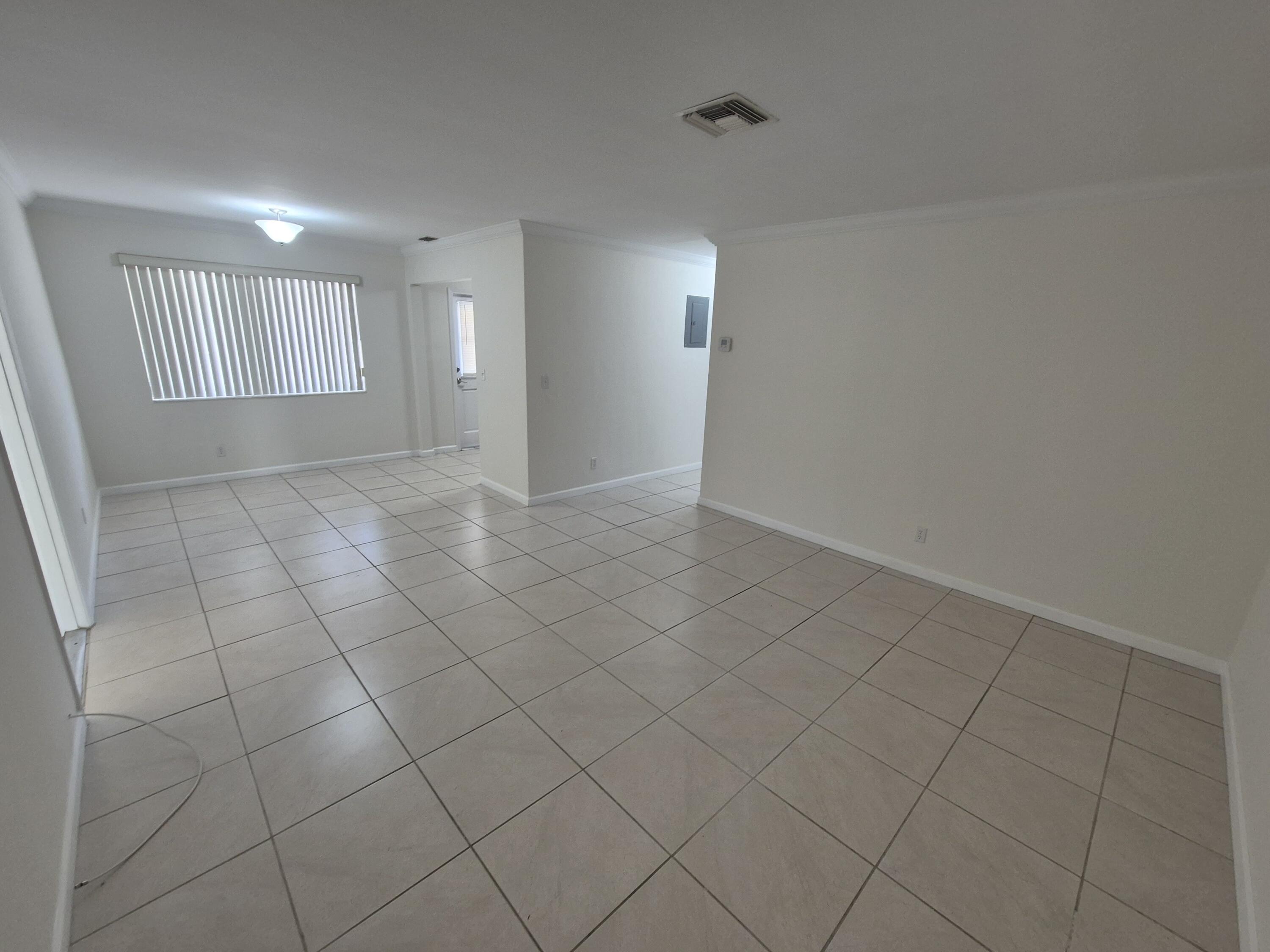 3518 Taylor Street, Unit 4 Hollywood, FL 33021 - Photo 3 of 13 a view of an empty room and window