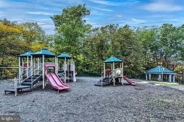 a view of a wooden deck with a table and chairs
