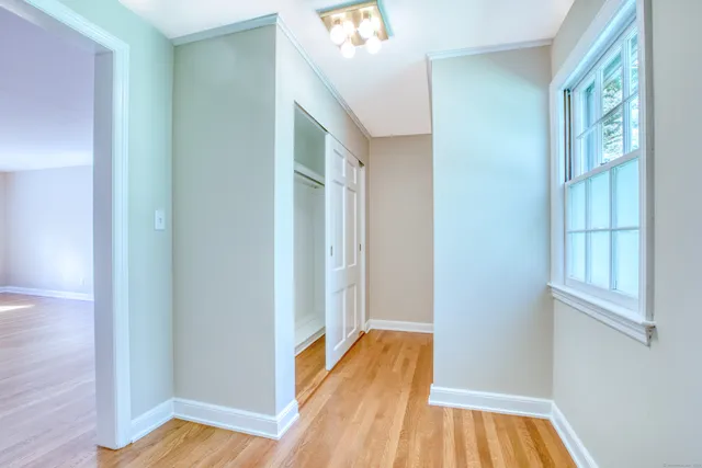 a view of front door with wooden floor