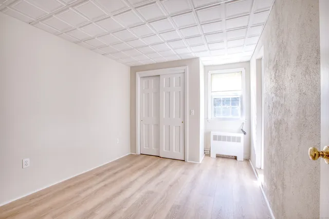 a view of wooden floor and windows in a room