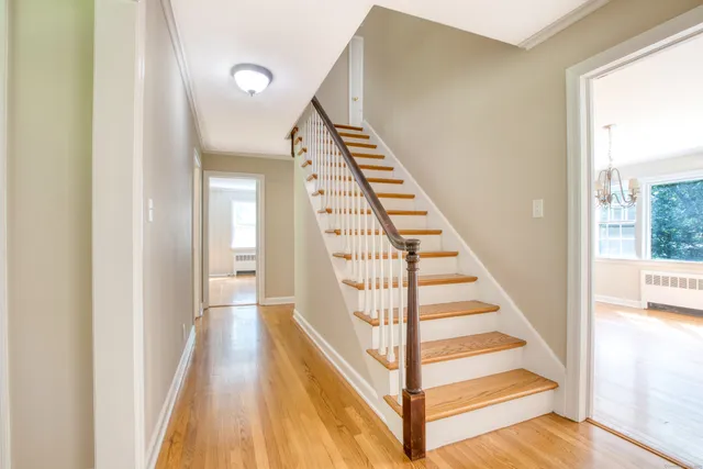 a view of staircase with white walls and windows