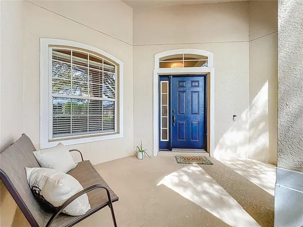 a living room with furniture and windows