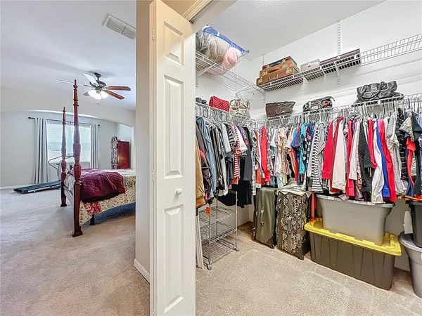 a spacious bathroom with a double vanity sink a mirror and a shower