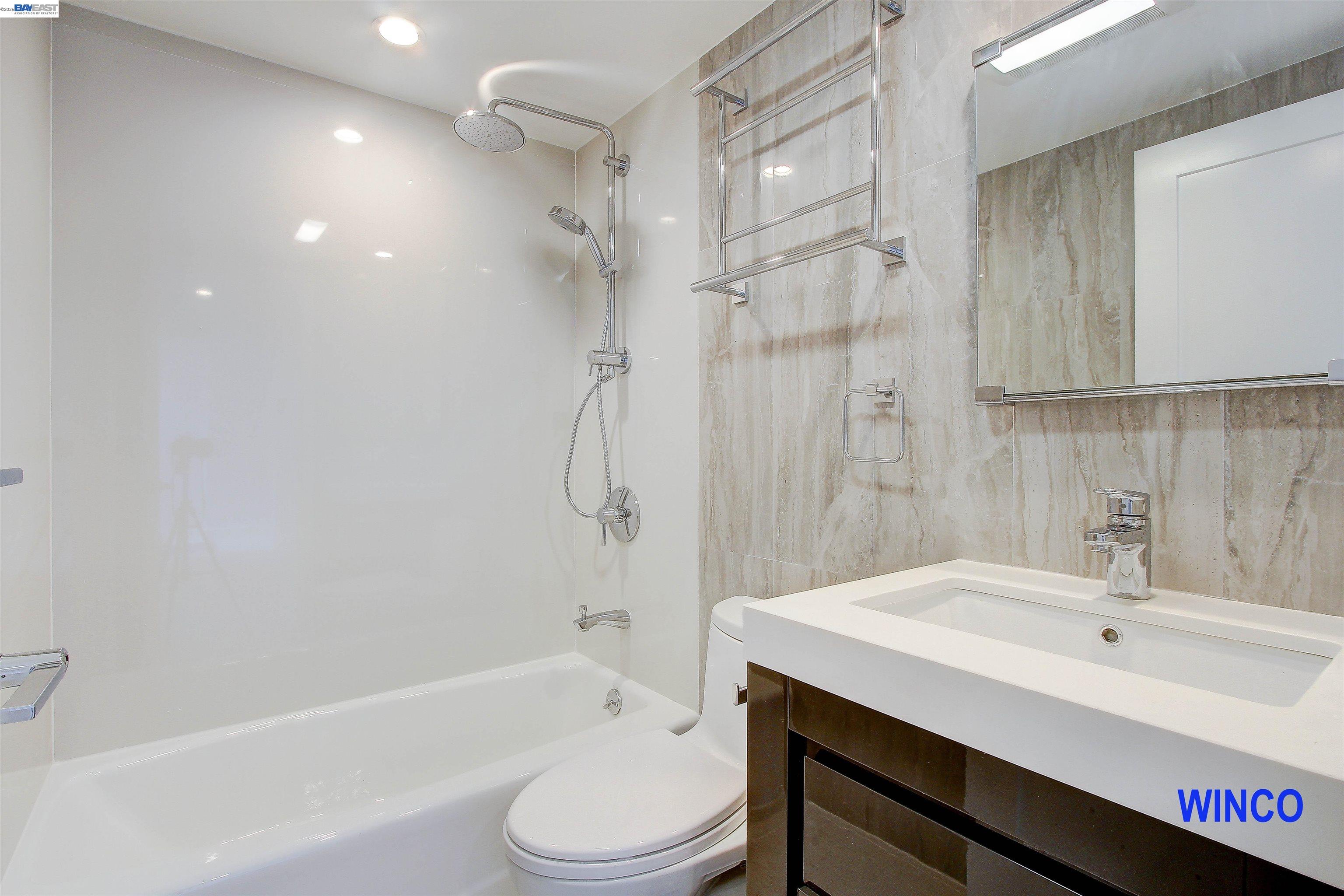 263 Ralston Street San Francisco, CA 94132 - Photo 13 of 28 a bathroom with a sink toilet a mirror and shower