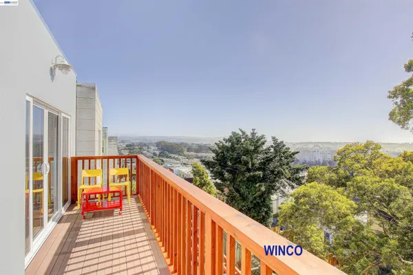 a balcony with an outdoor seating
