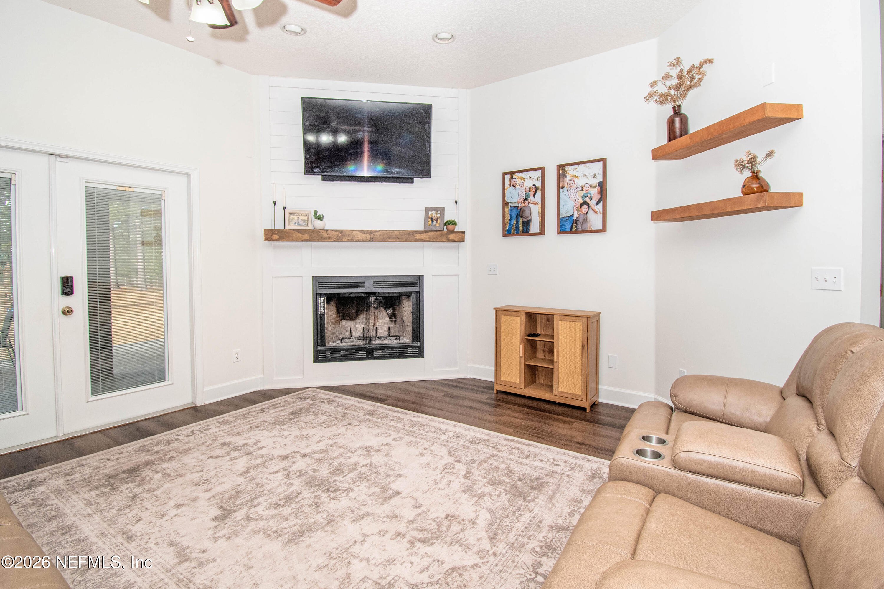 7733 Odis Yarborough Road Glen St. Mary, FL 32040 - Photo 14 of 45 a living room with furniture and a fireplace