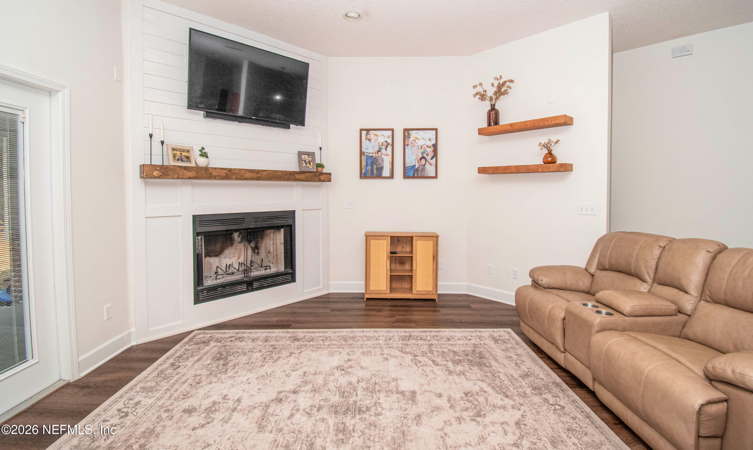 7733 Odis Yarborough Road Glen St. Mary, FL 32040 - Photo 15 of 45 a living room with furniture fireplace and flat screen tv