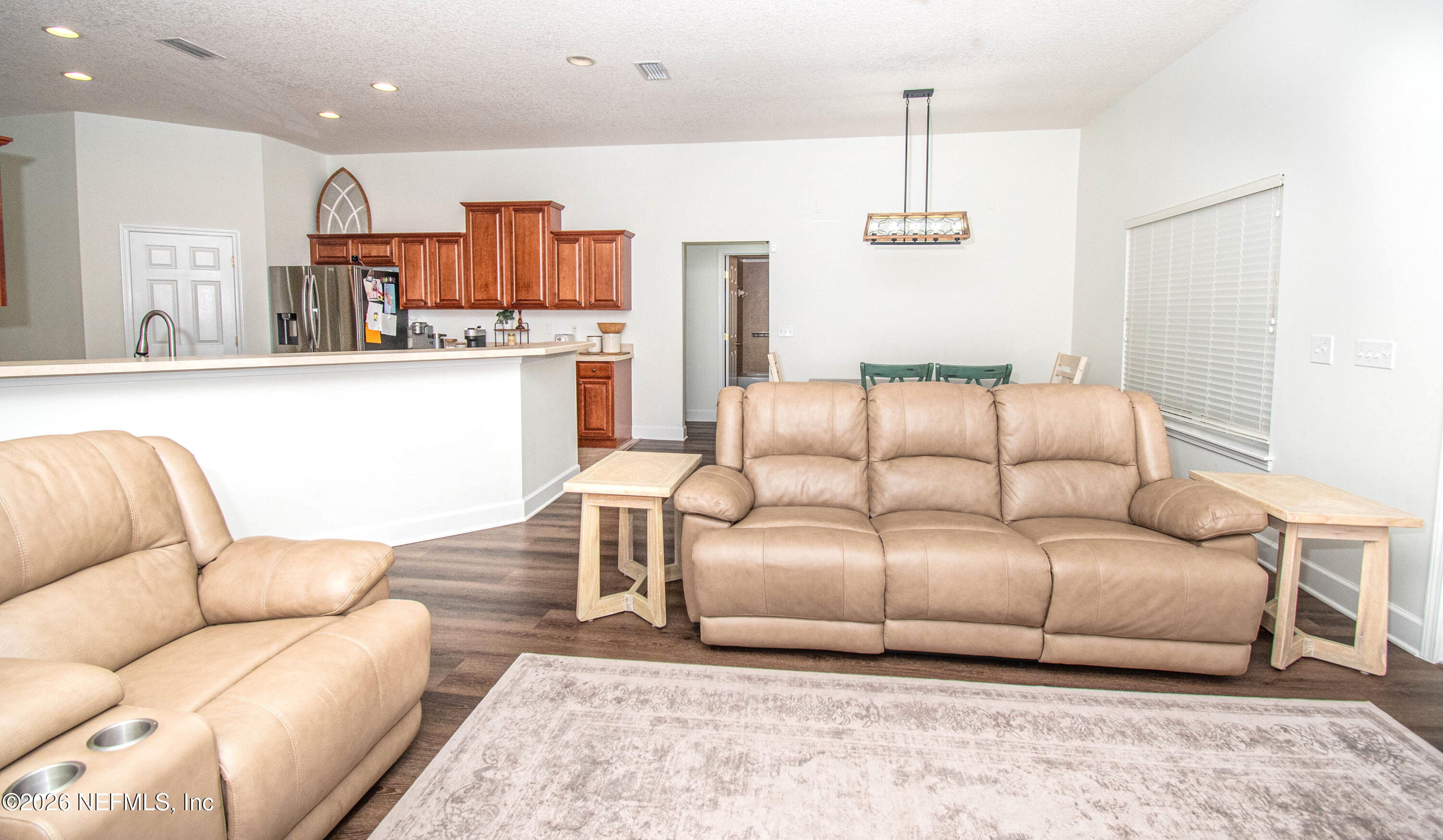 7733 Odis Yarborough Road Glen St. Mary, FL 32040 - Photo 16 of 45 a living room with furniture and a couch