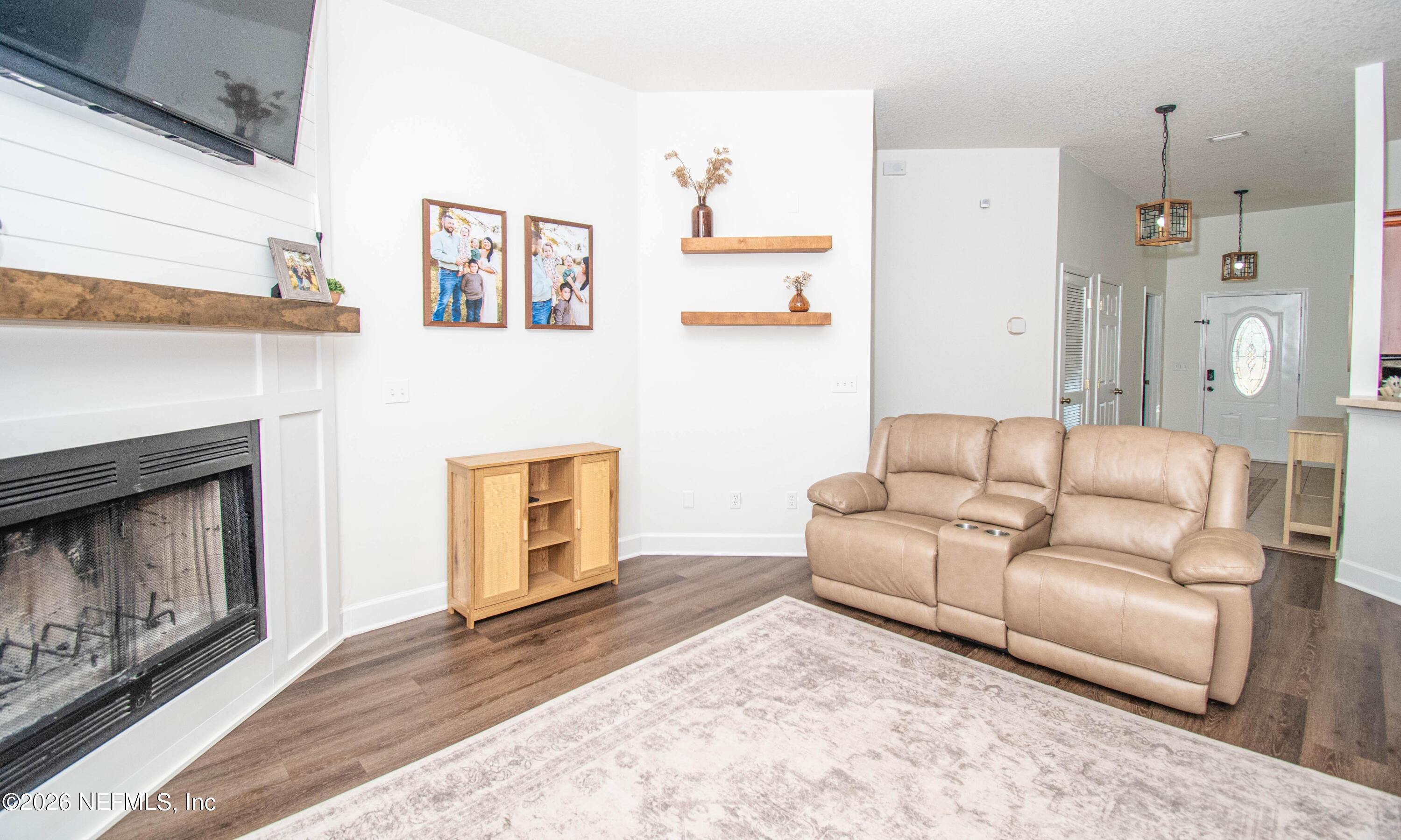 7733 Odis Yarborough Road Glen St. Mary, FL 32040 - Photo 18 of 45 a living room with furniture and a fireplace