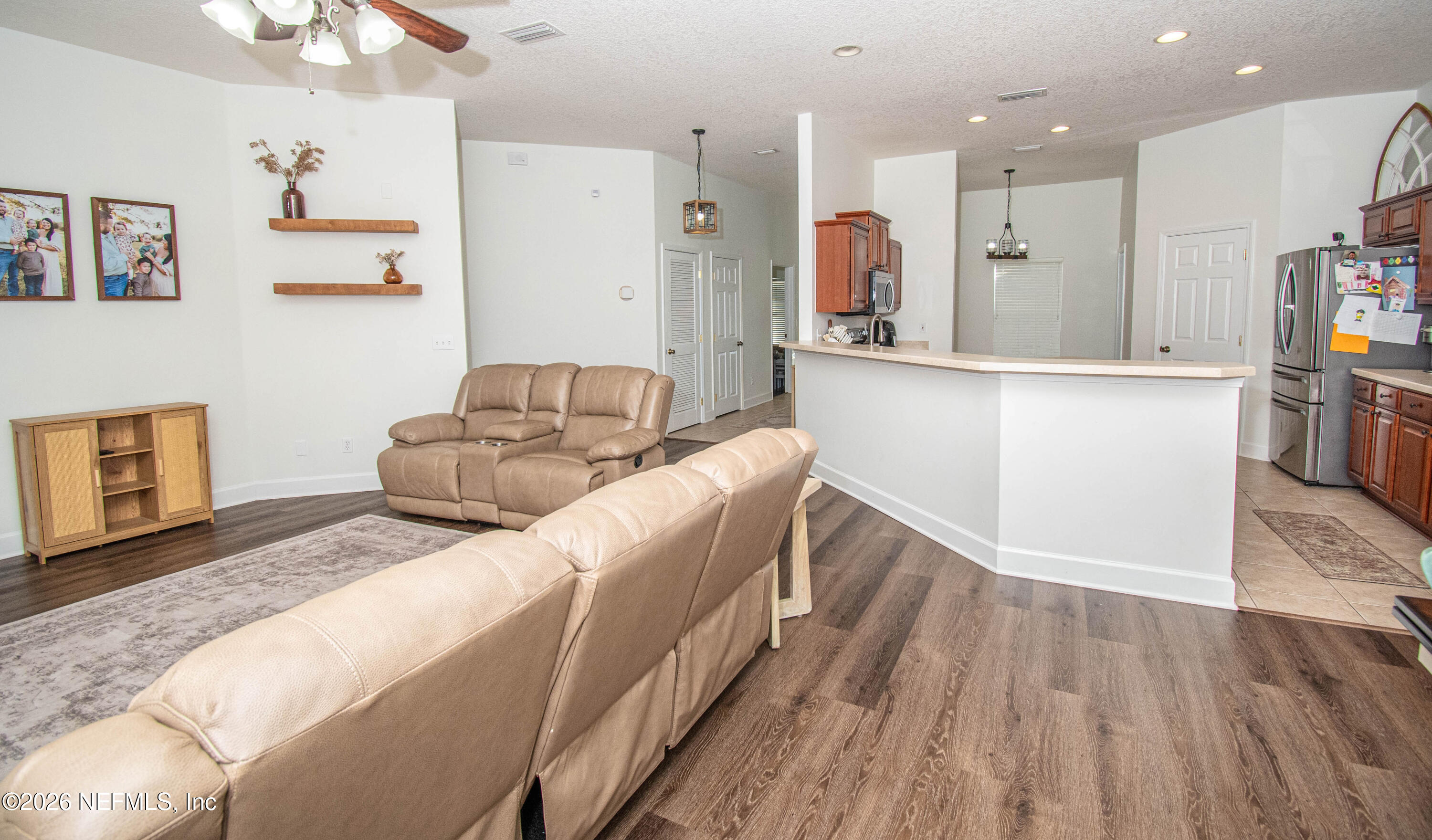 7733 Odis Yarborough Road Glen St. Mary, FL 32040 - Photo 21 of 45 a living room with furniture and a wooden floor
