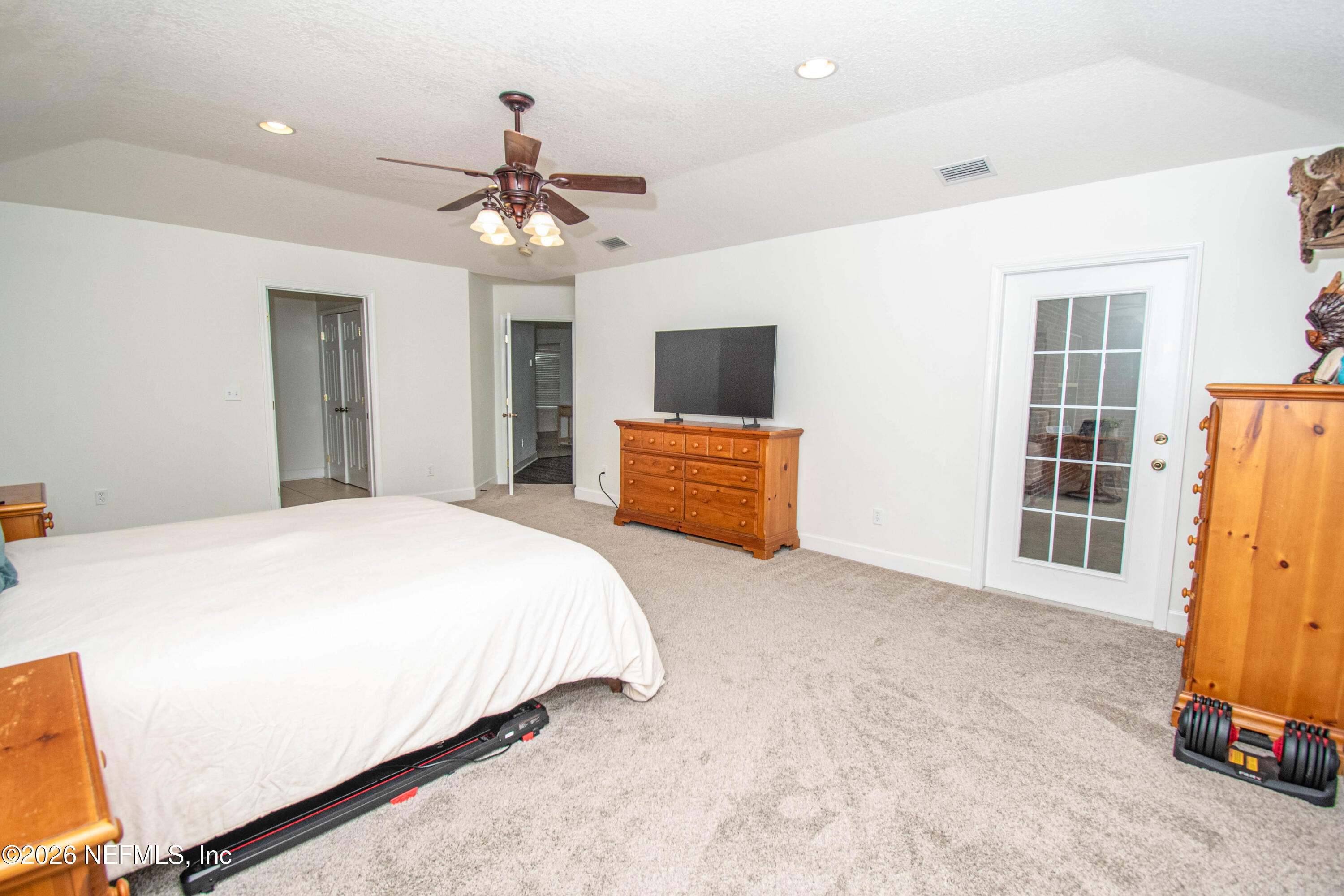 7733 Odis Yarborough Road Glen St. Mary, FL 32040 - Photo 23 of 45 a bedroom with a bed dresser and a window