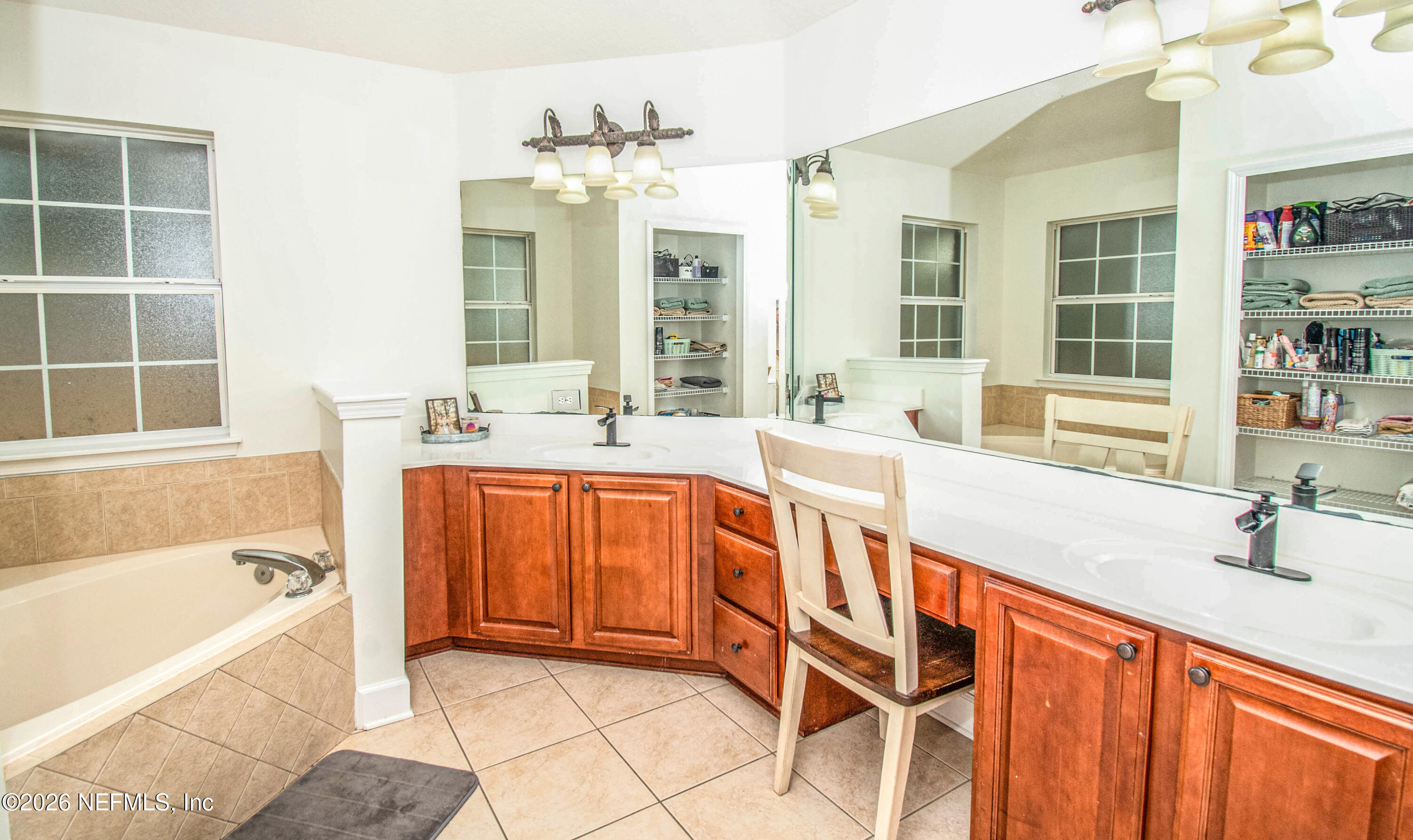7733 Odis Yarborough Road Glen St. Mary, FL 32040 - Photo 25 of 45 a spacious bathroom with a tub sink and mirror