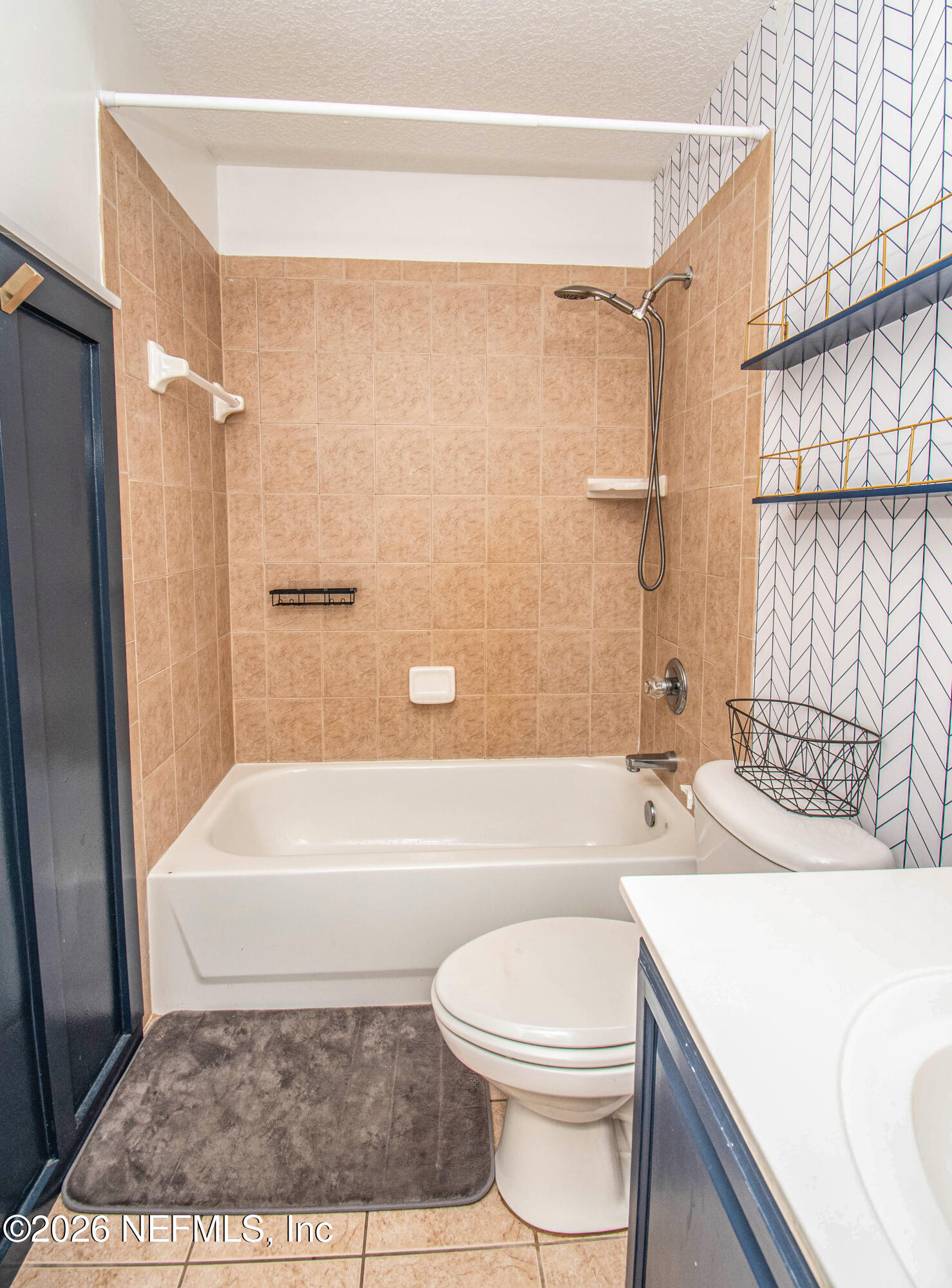 7733 Odis Yarborough Road Glen St. Mary, FL 32040 - Photo 32 of 45 a bathroom with a sink a toilet a bathtub and shower