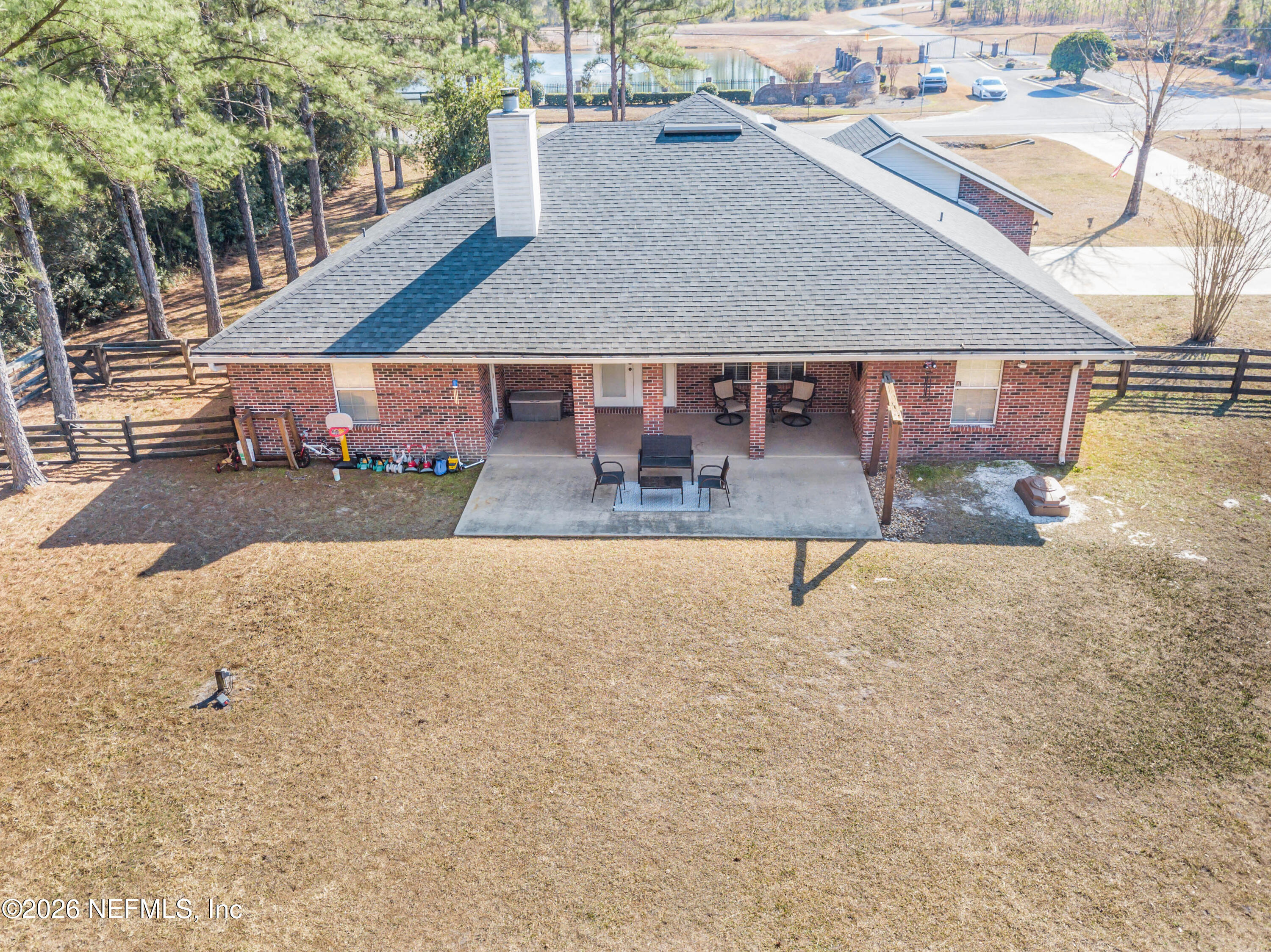 7733 Odis Yarborough Road Glen St. Mary, FL 32040 - Photo 40 of 45 an aerial view of a house with swimming pool