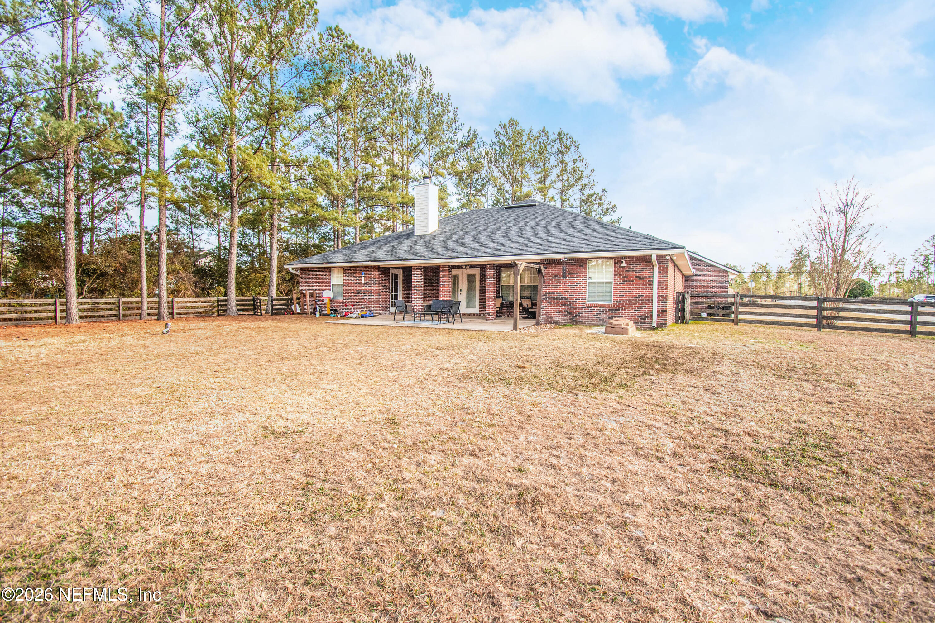 7733 Odis Yarborough Road Glen St. Mary, FL 32040 - Photo 41 of 45 a front view of a house with a yard
