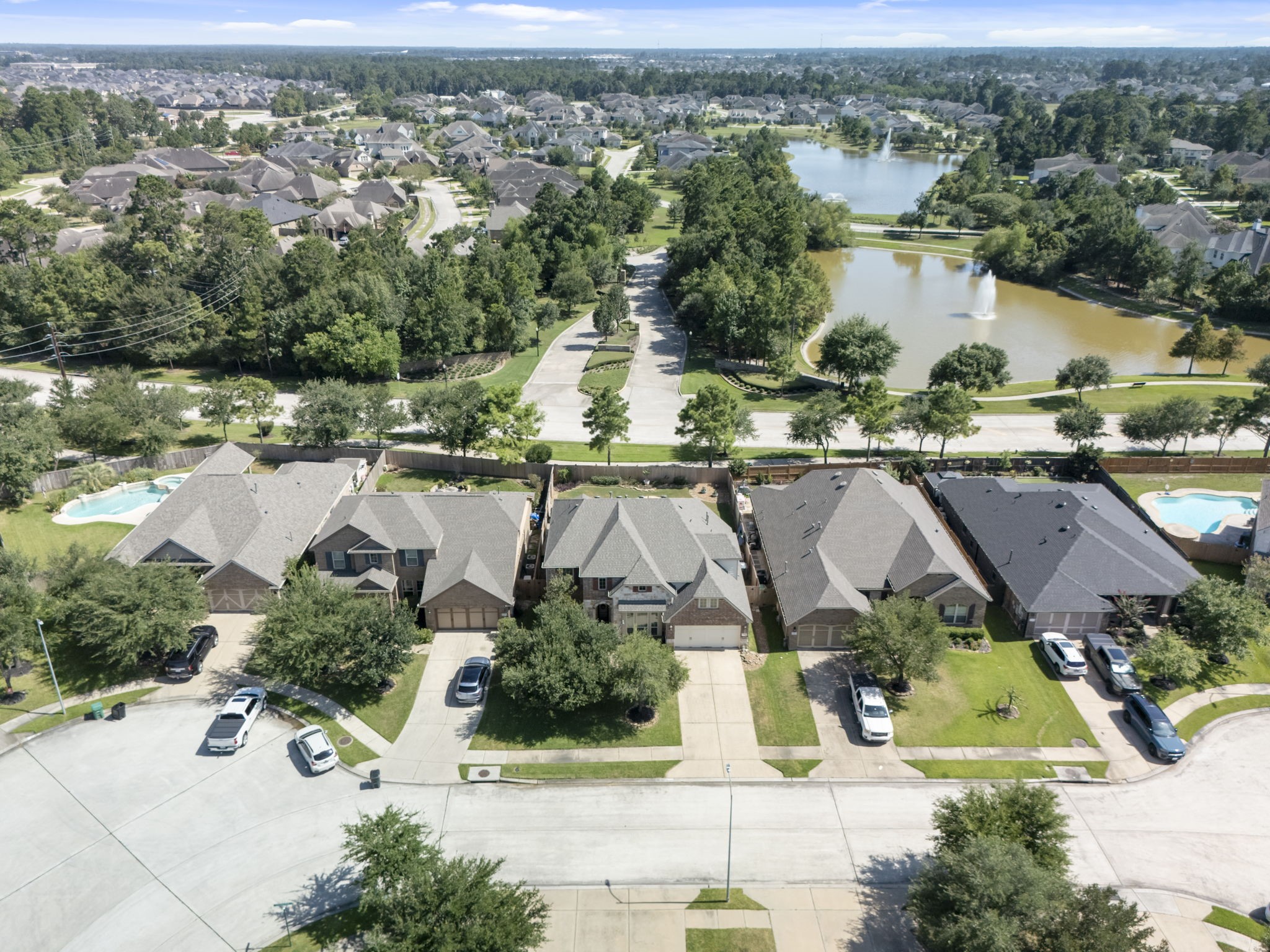 3318 Solvista High Court Spring, TX 77386 - Photo 31 of 33 Aerial view highlights the home's prime location on a quiet cul-de-sac street, backing to neighborhood green space with scenic lakes, fountains, walking trails, and nearby community amenities.