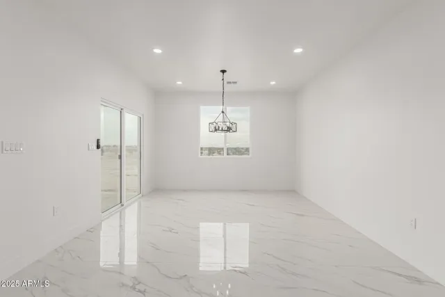 a view of an empty room and a window