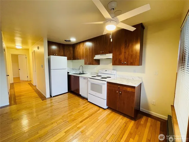 a view of kitchen with cabinets and stainless steel appliances