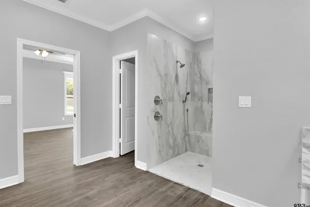 a bathroom with a glass shower door