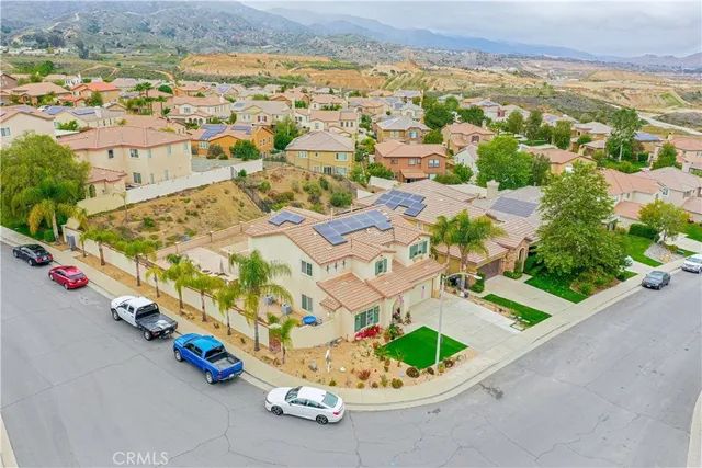 an aerial view of residential houses with outdoor space
