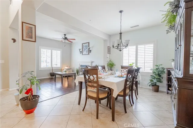 a view of a dining room with furniture and window