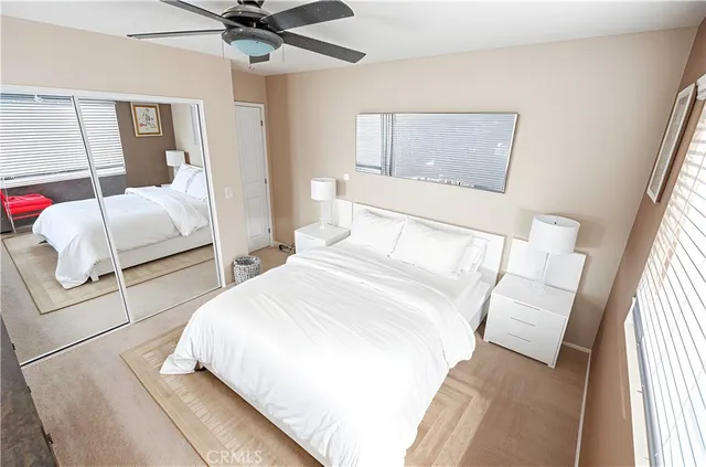 a bedroom with bed and window