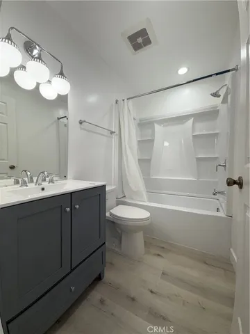 a bathroom with a sink a toilet and a bathtub