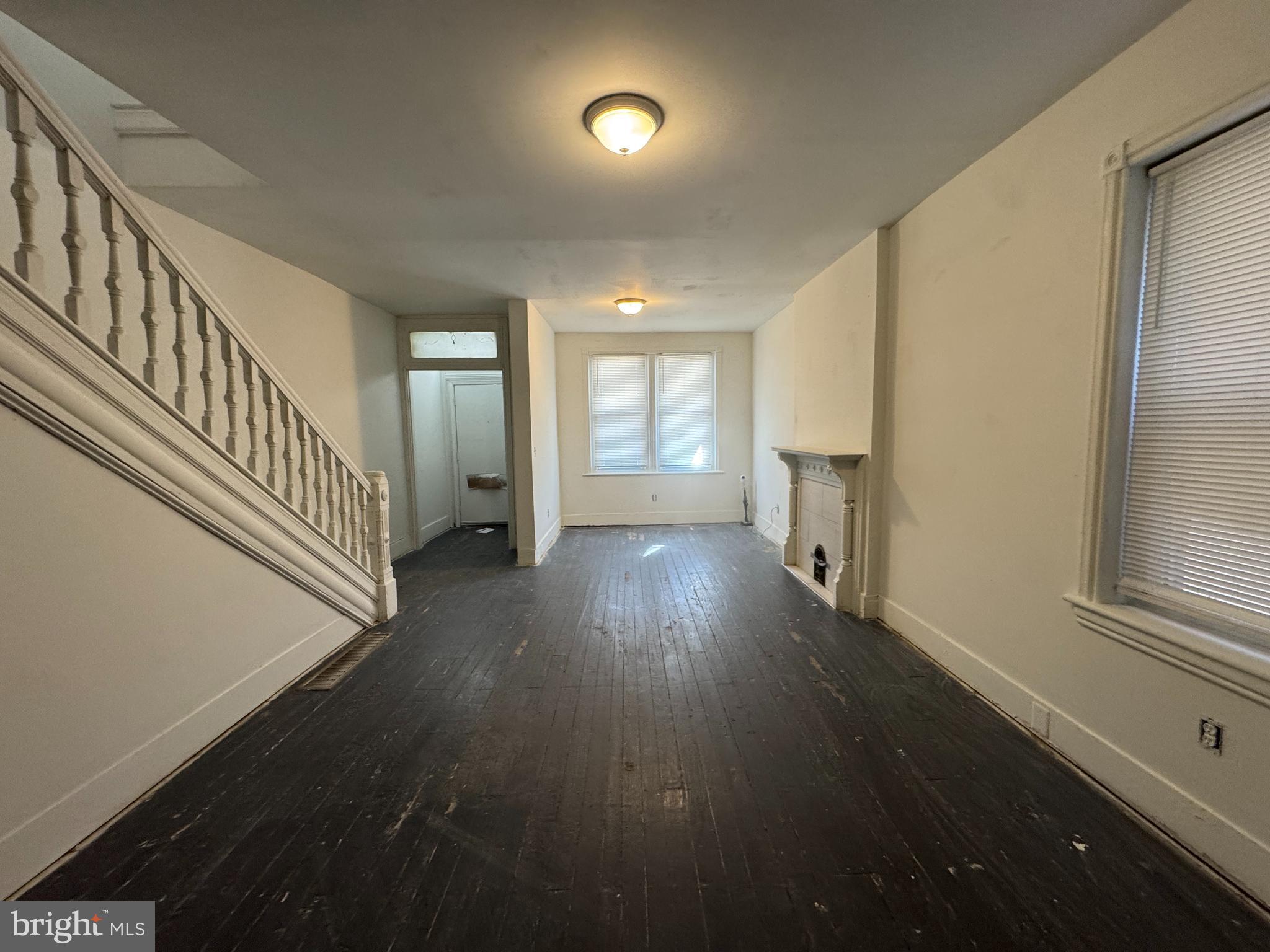 616 West 6th Street Chester, PA 19013 - Photo 4 of 15 wooden floor in an empty room with a window