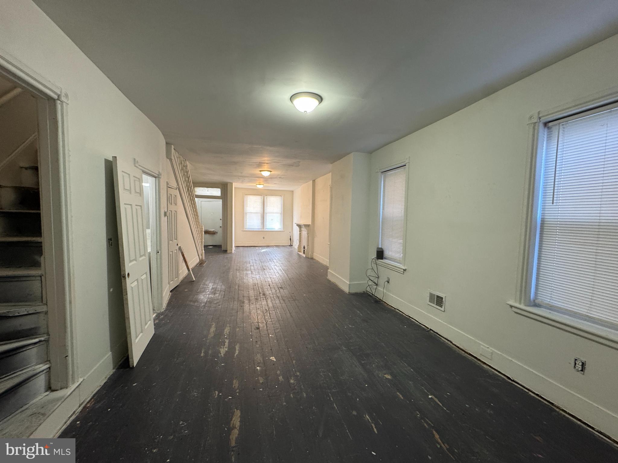 616 West 6th Street Chester, PA 19013 - Photo 6 of 15 a view of a hallway with wooden floor and staircase