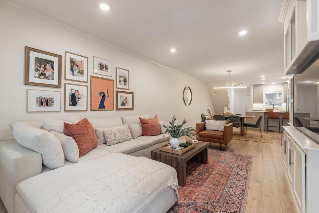 165 Cambridge Road, Unit 10 Woburn, MA 01801 - Photo 11 of 33 a living room with furniture potted plant and open kitchen view