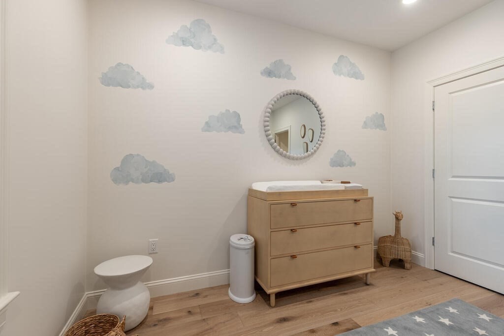 165 Cambridge Road, Unit 10 Woburn, MA 01801 - Photo 19 of 33 a bathroom with a toilet sink vanity and mirror