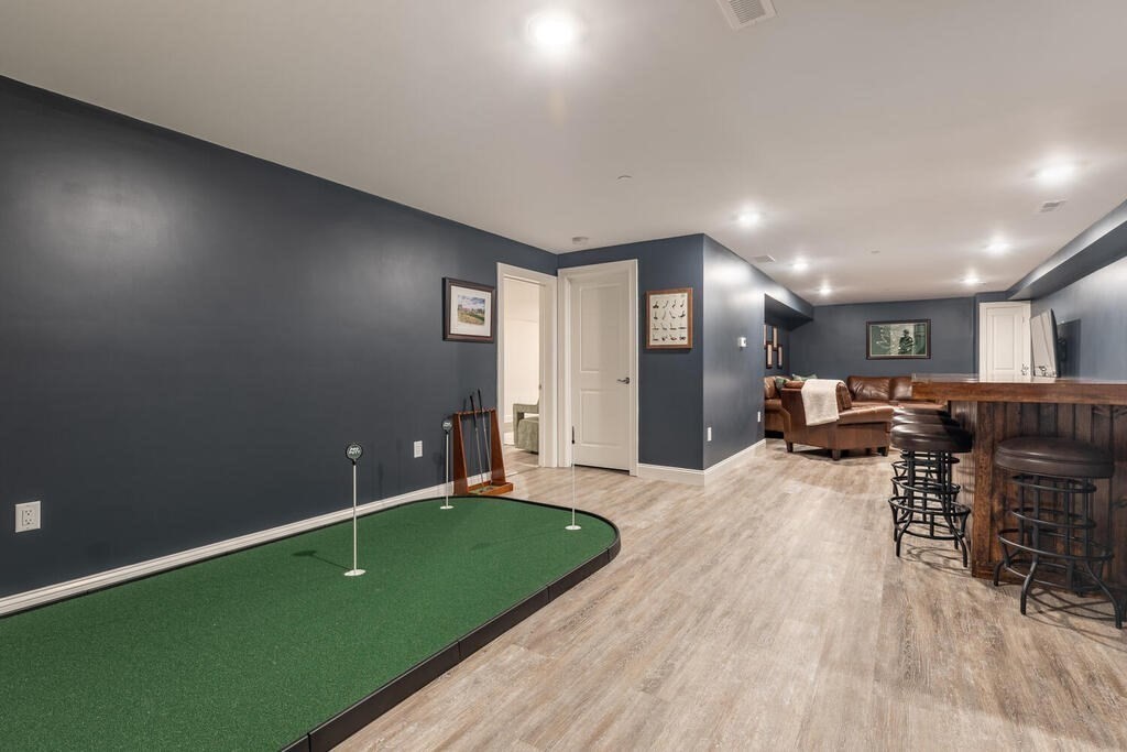 165 Cambridge Road, Unit 10 Woburn, MA 01801 - Photo 20 of 33 a living room with furniture and a wooden floor