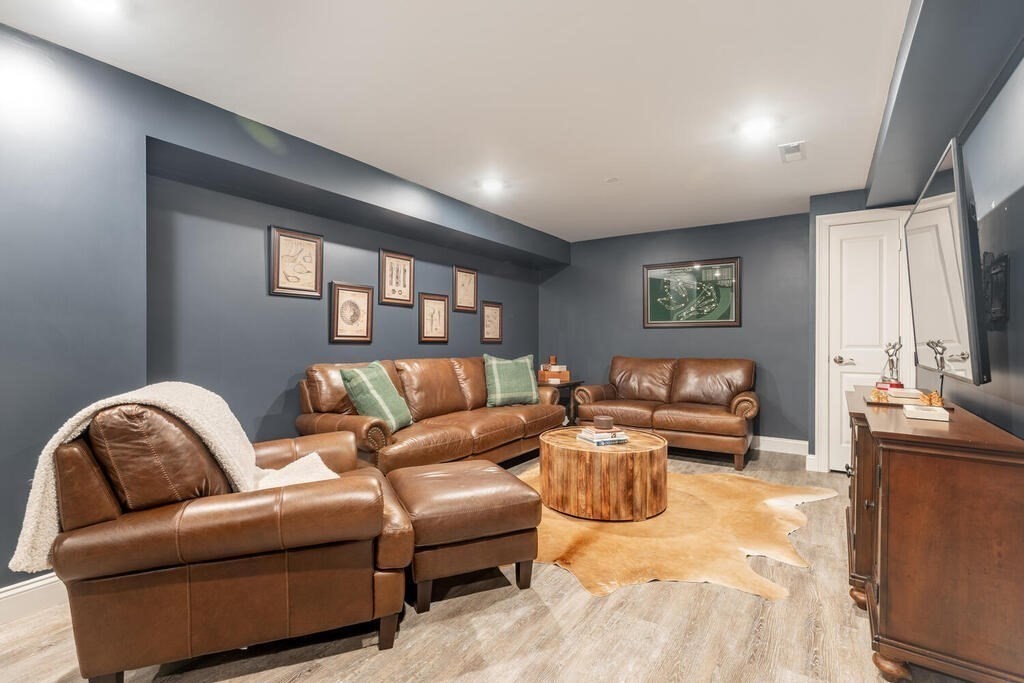 165 Cambridge Road, Unit 10 Woburn, MA 01801 - Photo 22 of 33 a living room with furniture ceiling fan and a window
