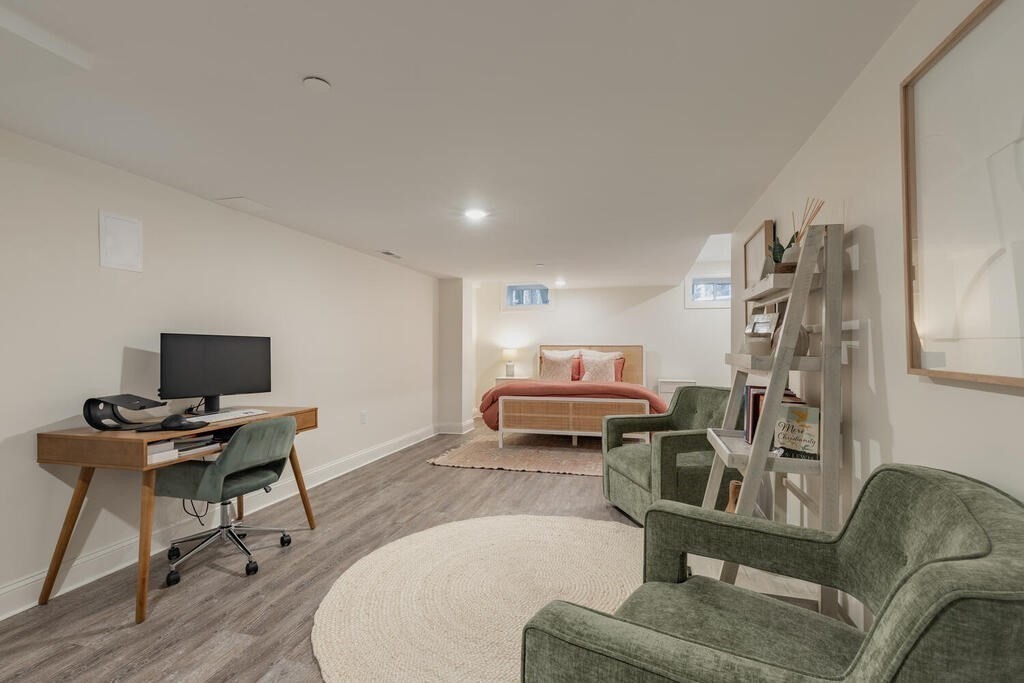 165 Cambridge Road, Unit 10 Woburn, MA 01801 - Photo 26 of 33 a living room with furniture and a flat screen tv